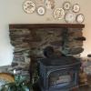 A grouping of Aesthetic brown transferware plates circa 1880's over a Pennsylvania mantel.